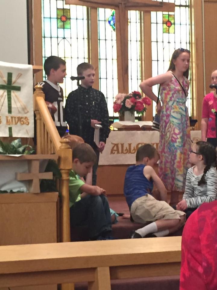 Kids presenting a program at the front of the sanctuary